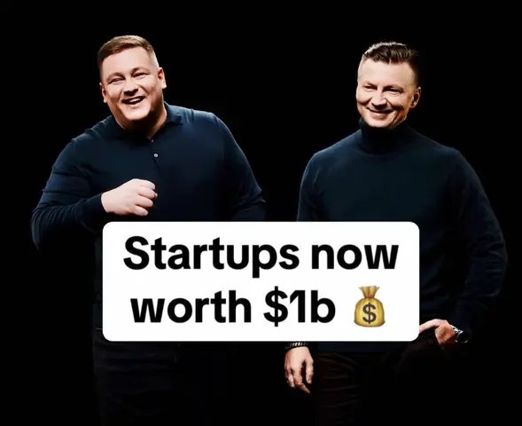 Two men are posed against a black background. A text overlay in a white rounded rectangle reads "Startups now worth $1b" with a money bag emoji.