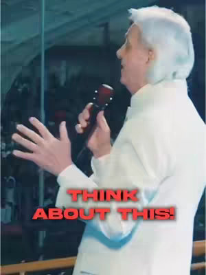 A man with white hair and a white suit speaks into a microphone. At the bottom of the image, text in red says, "THINK ABOUT THIS!"