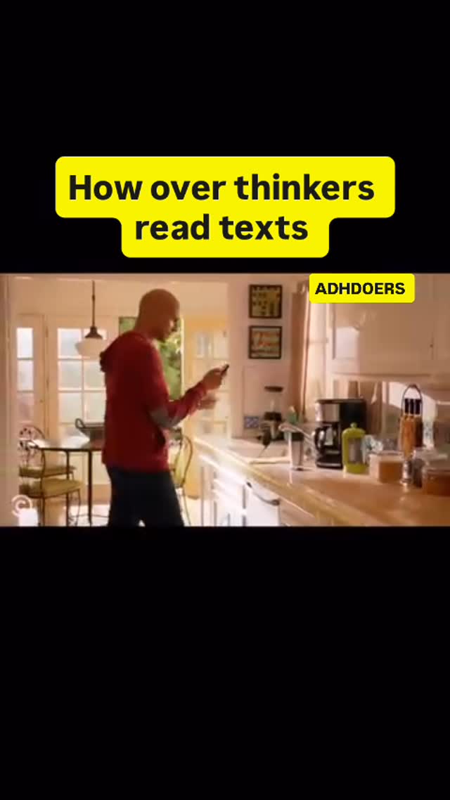 A man is in a kitchen, holding a phone. A yellow rectangular text overlay at the top reads 'How over thinkers read texts'.
