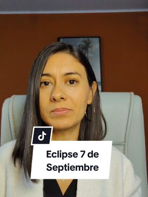 A woman with dark hair and a neutral expression sits in front of a blurred background. A text overlay reading "Eclipse 7 de Septiembre" is on the lower portion of the screen.