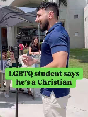 A man with a beard and dark hair is speaking with an excited expression, likely in an interview setting. A green label along the bottom says, 'LGBTQ student says he's a Christian'. The background includes some people and a building.