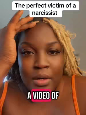 The cover image features a close-up of a light-skinned woman with blonde locs. Above, text reads "The perfect victim of a narcissist." Below her, a pink-bordered text box says "A VIDEO OF". The woman has brown eyes, is looking slightly to the side as she holds her hand up to her head, seemingly in thought. Her skin is tanned and a reddish-orange top is visible.