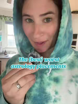 A woman wearing a teal tie-dye hoodie is looking at the camera and talking. Text overlayed on the image reads, "The (best) worst astrology placements."