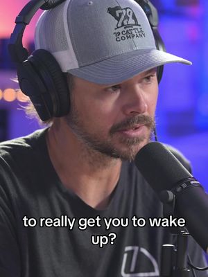 The cover image shows a man with a beard and a baseball cap wearing headphones and speaking into a microphone. The background is blurred, potentially a studio setting.