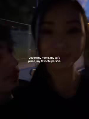 A blurry, low-light shot of a person's face close to another person's face, both out of focus. Text overlays the image.