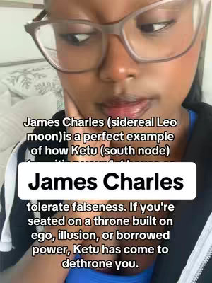 A close-up selfie shows a woman with glasses, looking slightly downwards with an expression suggesting thoughtfulness. Text overlays are present, with the main one reading 'James Charles' in sizable, bold white font, set against a dark background.