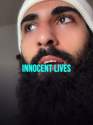 A close-up shot of a man with a full, dark beard and a white beanie, looking upwards with a pensive expression. The colorful text 'INNNOCENT LIVES' is superimposed at the bottom.