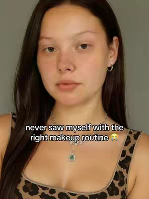 The cover image shows a close-up of a light-skinned woman, facing the camera. She has long, dark hair and is wearing a leopard print top and a necklace. Text overlay is placed in the bottom part of the image.