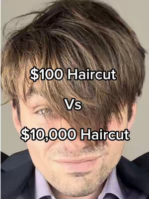 A close-up shot of a man's face against a blurry background. The man has light skin, short, dark hair, and is wearing a dark blazer over a light blue shirt. Text overlays read '$100 Haircut' above 'Vs' and '$10,000 Haircut' below.