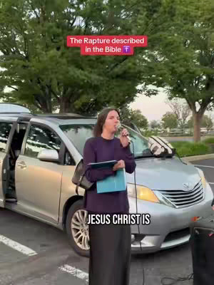 A woman stands in front of a silver minivan, speaking into a microphone. Text overlays read, "The Rapture described in the Bible" and "JESUS CHRIST IS". The background includes trees and a parking lot.