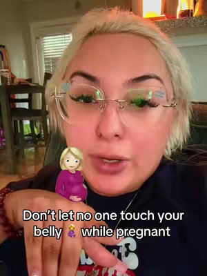 A woman with blonde hair and glasses is centered in the image, appearing to speak to the camera. Below her is an emoji of a pregnant woman. Text overlays the image, and a background that is slightly blurred is visible.