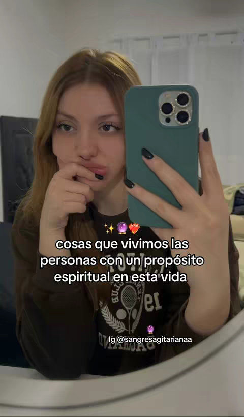 A selfie-style cover image featuring a young woman holding a phone, positioned to capture her face and hand. Text overlayed on the image provides context related to spirituality and purpose.