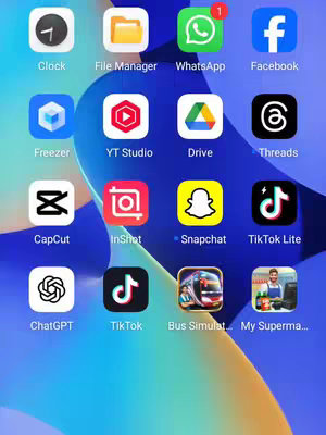 A screenshot of a smartphone's home screen is displayed, showcasing a grid of app icons against a background that gradients from light blue to a yellower hue. The layout is orderly, with apps arranged in rows and columns, denoting different functionalities. The primary colors visible in the image are blue, yellow, red, green. The overall composition leans towards a digital and simple aesthetic.
