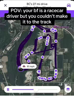 A map overlay showing a race track with a highlighted driving route. A text overlay at the top describes the scene, along with stats for the driving scene with the car icon.