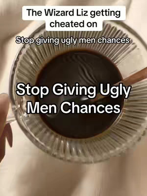 The image shows a close-up view of a clear glass cup filled with dark liquid, likely coffee, and a wooden spoon resting inside. Text overlays appear in multiple layers, with the top one reading 'The Wizard Liz getting cheated on' in a clear, sans-serif font. Below it, slightly smaller text states 'Stop giving ugly men chances'. At the bottom, the same phrase is repeated in a bold, sans-serif font, filling most of the visual space. The background is soft, and the overall composition is simple, focusing on the cup and the text.