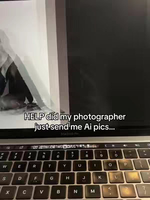 The image shows a laptop displaying what appears to be a partially visible person, likely behind a white backdrop and a black screen that create a sense of spatial depth. The laptop keyboard is prominent in the foreground, and the overlaid text includes 'HELP did my photographer... send me Ai pics...'.