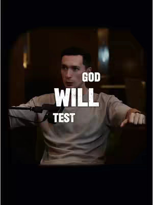 The cover image features a man in the center holding a microphone, the words GOD, WILL, and TEST are displayed across the center.