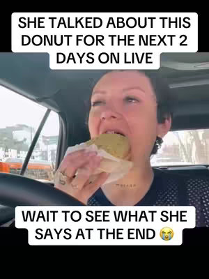 A woman is shown inside of a vehicle, the camera focused on her face as she takes a bite of a donut. Text overlays are present at the top of the image and the bottom.