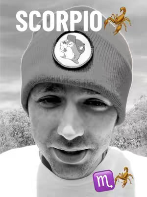 A grayscale selfie of a man wearing a gray beanie with a circular patch. Text that appears to be 'SCORPIO' is at the top, with a cartoon scorpion on top of the hat. A purple square displaying the Scorpio astrological sign is next to a cartoon scorpion at the bottom right, while a scorpion is also placed to the upper-right. The background fades to a white and gray tone.