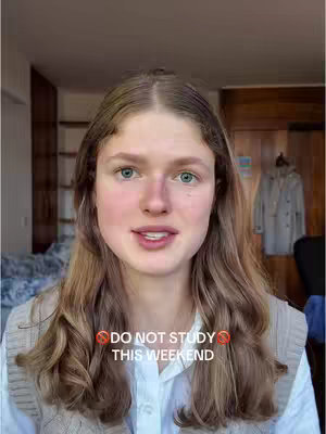 A young woman with long blonde hair looks directly at the camera. She is wearing a white shirt and a light-colored vest. The background appears to be a room with wooden doors and a glimpse of a bed. Text overlayed on the image says 'DO NOT STUDY THIS WEEKEND'.
