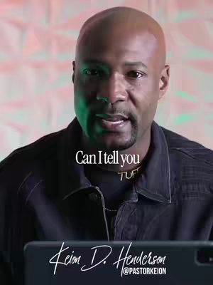 A man with a shaved head and a black shirt is speaking directly into the camera. Text overlays read 'Can I tell you' in a cursive font and 'Keion D. Henderson @pastorkeion' in a clean, white font. The background has an alternating pink and green lighting.