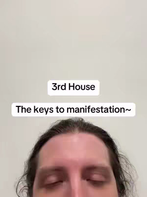 A selfie-style image with a light gray background. At the bottom is the top of a person's face, eyes closed.. Above is a white rectangle with '3rd House' in a bold, simple font, centered. Beneath this is another rectangle with the text 'The keys to manifestation~'.