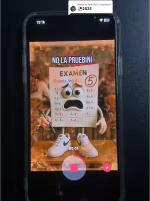 A smartphone screen displays an animated cartoon of a test paper with arms, legs, and a distressed expression. "NO LA PRUEBINI" is written at the top in red, and "EXAMEN" is below it. The test paper figure is wearing Nike shoes, and has the number 5 in a circle. The background appears to be out of focus with a blurred appearance.