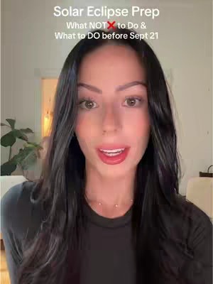 A woman with long dark hair is centered in the frame. The background is softly lit, including a glimpse of a doorway and a houseplant. The woman is looking directly at the camera and has a positive facial expression. There is text overlayed at the top of the frame, which displays the video’s title and related information related to the upcoming solar eclipse.