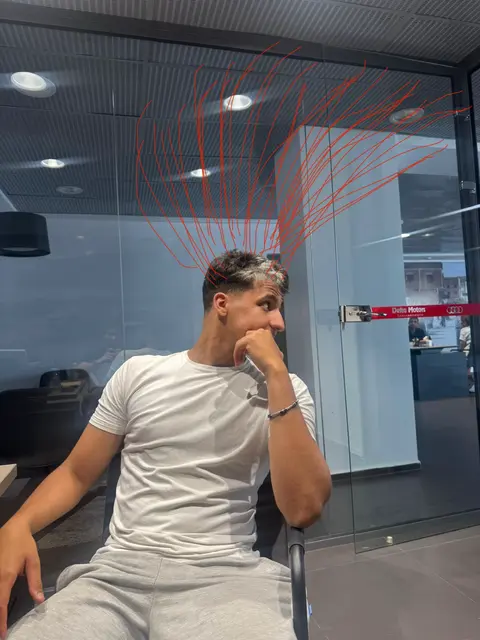 The cover image shows a young man sitting down with his hand on his chin in thought. Above his head, red lines have been added to give the impression of electricity, and there is a glass wall/window behind, reflecting the interior lights.