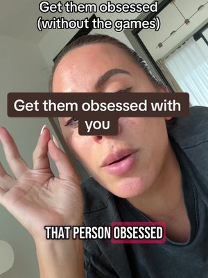 A selfie-style shot featuring a woman gazing towards the camera with a slightly open mouth. Her hand is up near her face, and text overlays are placed at the top/bottom.