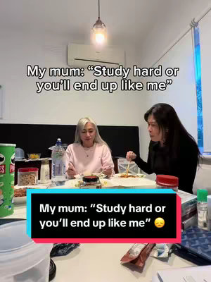 The cover image shows two women at a table, one with silver hair and the other with long black hair. Text overlays the image, framed in a black and blue box.