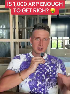 A man in a patterned shirt is holding a microphone and talking. Above him is a red banner with white text asking a question about XRP. The background is a blurred interior.
