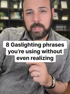 A man with a beard and short hair is centered in the self-shot. He is wearing a gray button-down shirt and has a ring on his finger. A text overlay, white rectangular with black borders, features the title of the video at the center.