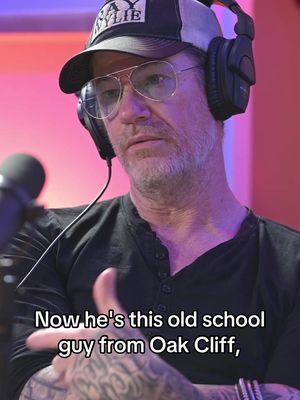 A middle-aged man with glasses, a black shirt, and a baseball cap, seemingly in a podcast setup. He's wearing headphones and looking slightly off-camera. Text overlayed offers a quote and context.