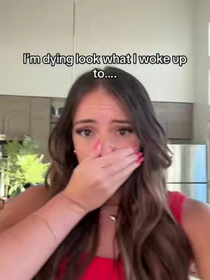 A woman with long brown hair covers her mouth with her hand in a gesture of surprise or emotion. Text overlayed says, 'I'm dying look what I woke up to....'