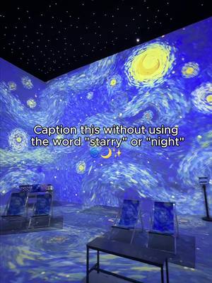 An immersive art installation displaying a recreation of Van Gogh's 'The Starry Night' painting. The scene includes chairs oriented to face the walls and ceiling, which are covered in the swirling blue and yellow artwork. The ceiling recreates the night sky with tiny lights resembling stars.