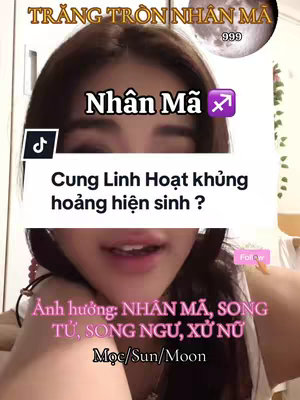 The cover image features a headshot of a person against a blurred background. The person is looking at the camera with a slight smile and talking. The image has several text overlays: A top banner reading "TRĂNG TRÒN NHÂN MÃ 999". A primary headline stating "Nhân Mã" accompanied by the Sagittarius zodiac symbol. A white rectangle containing the text "Cung Linh Hoạt khủng hoảng hiện sinh ?"  and bottom text which reads  "Ảnh hưởng:  NHÂN MÃ, SONG TỬ, SONG NGƯ, XỬ NỮ Mộc/Sun/Moon". The overall composition is well-lit, with a focus on the person's face and the stylized text elements.