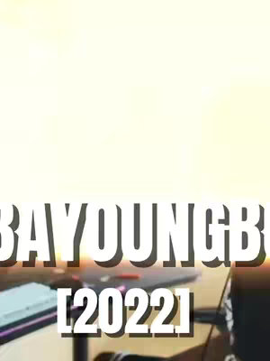 The cover image presents a slightly skewed vertical frame featuring overlaid text against a blurred and brightly lit background that seems to hint at a room. The text includes the name"NBA YoungBoy", the year "[2022]" and more details which are added for context and searchability.