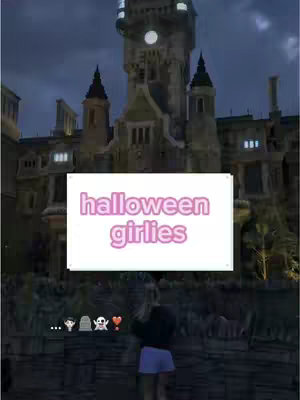 The cover image shows a large, ornate building at night with bright lights. A text overlay in a pink font reads "halloween girlies" on a white rectangle. In the lower-left corner are some emoji icons like ghosts and hearts, and in the foreground is a person facing towards the building.