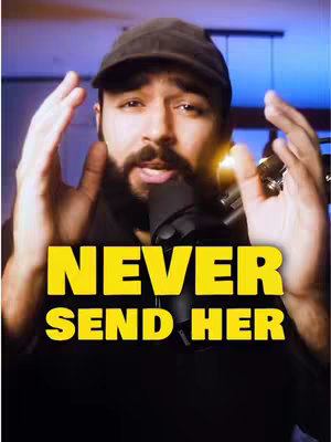 A man facing the camera, his hands up on either side of his head. He is wearing a black cap, and a microphone is pointed toward him. The words "NEVER SEND HER" in large, yellow, bold letters are overlaid across the image.