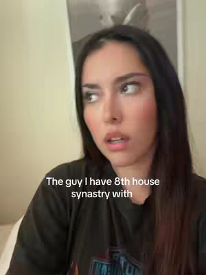 A woman with dark hair and slightly concerned expression is looking off to the side. Text overlay reads, "The guy I have 8th house synastry with."