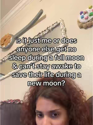 The cover image features a woman with reddish-brown curly hair in the bottom center, framed from the shoulders up. Behind her, a reflective surface is adorned with white material. A spoon-shaped object is seen on the wall, partially holding a beige substance, above which a mirror. The background is light-colored and textured. Text is layered over the image in a white font.