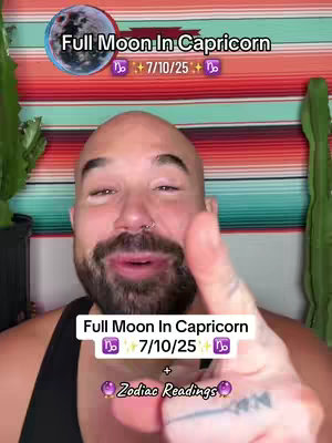 The image shows a man in the center, likely filming a video, with the top portion showing a superimposed layer of text about a full moon in Capricorn. Behind these layers is a colorful, striped background. The man is bald with a beard, and his hand is raised, pointing towards text displayed below his face. There are large cactus plants on either side of the image.
