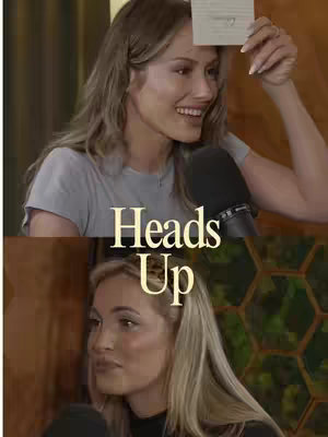 The cover image is split into two sections of a woman. The top half shows a woman with long, wavy, light brown hair, smiling and holding a card. A microphone is right in front of her.  The bottom half displays another smiling woman with similar features. The background varies in both sections with a blurred setting.
