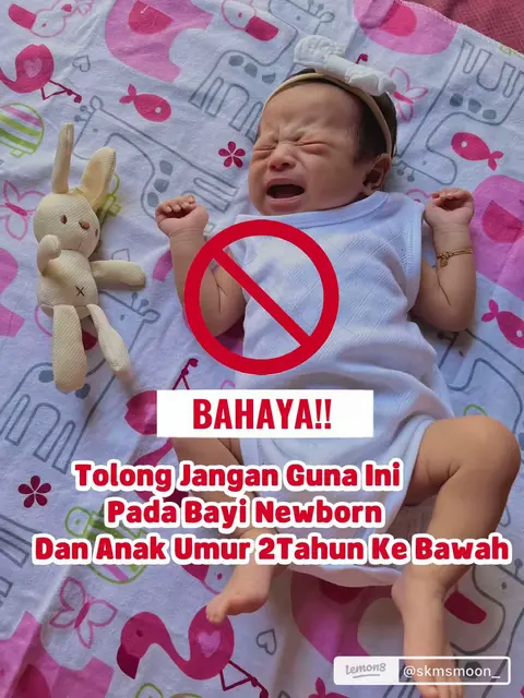 The image shows a crying baby lying down with red cross signs overlaid, suggesting a warning.
