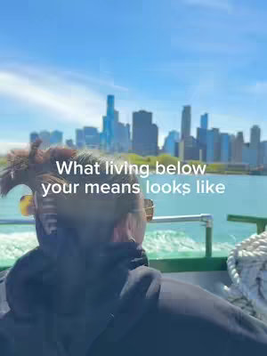 A person with dark hair, wearing sunglasses and a black hoodie, stands on what appears to be a boat, gazing out at a city skyline under a bright blue sky. The composition favors the back of the person, while the text overlay provides a core message.