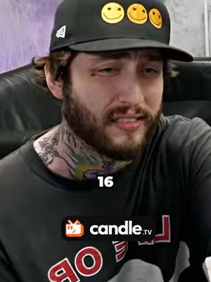 The image shows a person with a beard wearing a black cap with smiley faces, against a blurry background. On the person's neck there are tattoos. At the bottom of the shot, there is a logo for candle.tv, and a layer of text with the number 16. The person appears to be speaking or emoting.