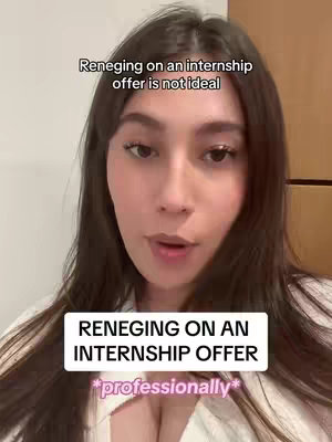 A woman with long dark hair is centered in the frame, looking at the camera. Text overlays are positioned above and below her face. The background is blurred, suggesting an interior setting.