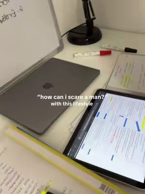 A desk setup with a laptop, tablet, and other study materials. Text overlayed on the image asks, "how can I scare a man?" with this lifestyle.