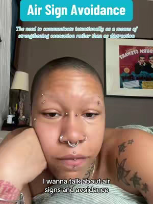 A close-up shot features a person with a shaved head, multiple facial piercings, and tattoos on their arm. Text overlays include the title "Air Sign Avoidance" and the tagline "The need to communicate intentionally as a means of strengthening connection rather than as distraction." Below, a text overlay reads, "I wanna talk about air signs and avoidance."